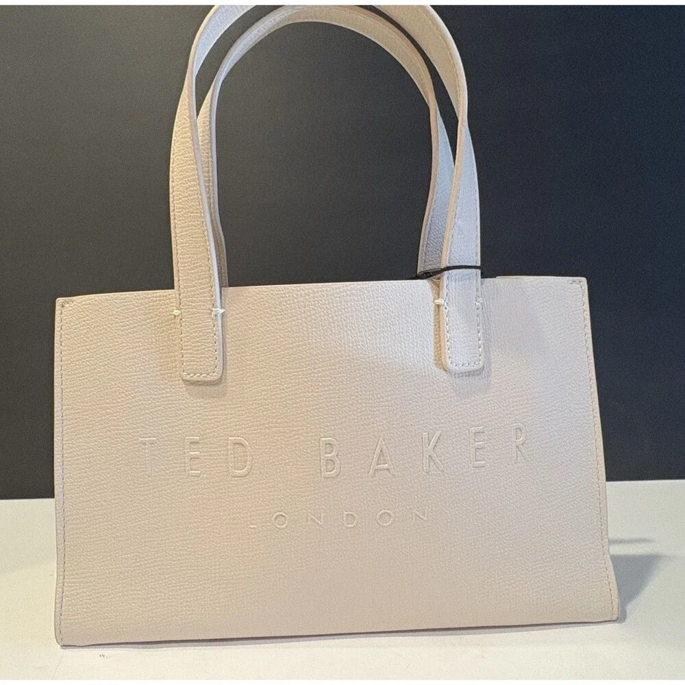 Ted Baker Icon small tote bag in a cream-colored, structured material.